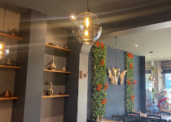 Angel wings on the wall, hanging glass pendants and shelves